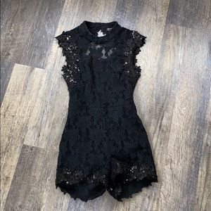Black lace and sequin open back romper!